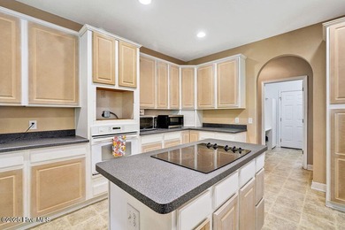 This spacious, 4-bedroom home offers an open floor plan for the on Carolina Shores Golf Course in North Carolina - for sale on GolfHomes.com, golf home, golf lot