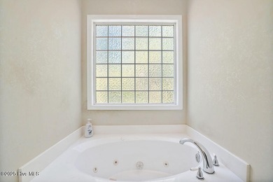 This spacious, 4-bedroom home offers an open floor plan for the on Carolina Shores Golf Course in North Carolina - for sale on GolfHomes.com, golf home, golf lot