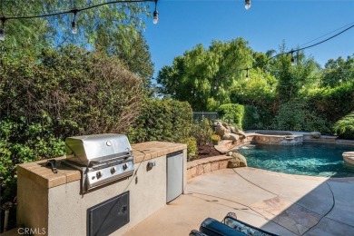 This Valencia Woodlands Ironwood pool home offers a rare large on Valencia Country Club in California - for sale on GolfHomes.com, golf home, golf lot