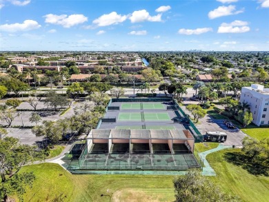 Beautifully updated 3 bedroom, 2 bath first-floor corner condo on Sunrise Lakes Phase IV Golf Course in Florida - for sale on GolfHomes.com, golf home, golf lot
