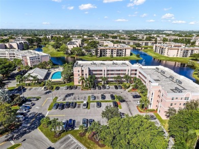 Beautifully updated 3 bedroom, 2 bath first-floor corner condo on Sunrise Lakes Phase IV Golf Course in Florida - for sale on GolfHomes.com, golf home, golf lot