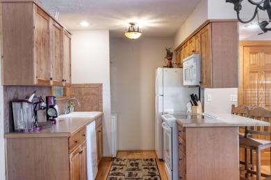 Tucked within the scenic Stonebridge Golf Village, this cozy on Ledgestone Country Club and Golf Course in Missouri - for sale on GolfHomes.com, golf home, golf lot