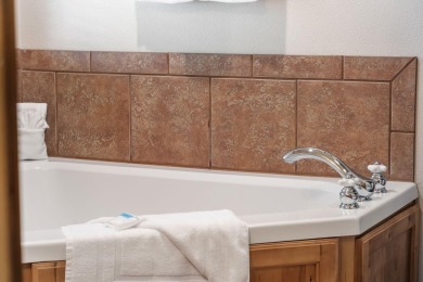 Tucked within the scenic Stonebridge Golf Village, this cozy on Ledgestone Country Club and Golf Course in Missouri - for sale on GolfHomes.com, golf home, golf lot