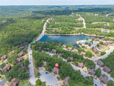 Tucked within the scenic Stonebridge Golf Village, this cozy on Ledgestone Country Club and Golf Course in Missouri - for sale on GolfHomes.com, golf home, golf lot