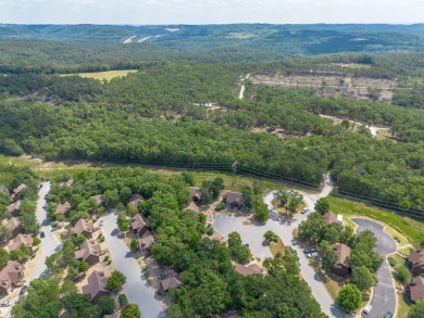 Tucked within the scenic Stonebridge Golf Village, this cozy on Ledgestone Country Club and Golf Course in Missouri - for sale on GolfHomes.com, golf home, golf lot