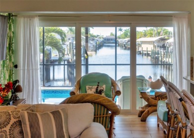 This furnished-remodeled Gulf Access home, nestled at the end of on Royal Tee Country Club in Florida - for sale on GolfHomes.com, golf home, golf lot