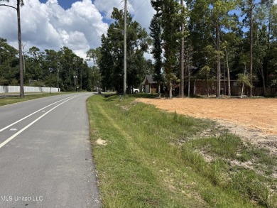 Exceptional opportunity to own a partially wooded lot featuring on Diamondhead Country Club in Mississippi - for sale on GolfHomes.com, golf home, golf lot
