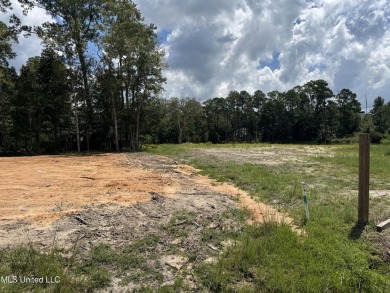 Exceptional opportunity to own a partially wooded lot featuring on Diamondhead Country Club in Mississippi - for sale on GolfHomes.com, golf home, golf lot