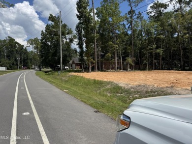 Exceptional opportunity to own a partially wooded lot featuring on Diamondhead Country Club in Mississippi - for sale on GolfHomes.com, golf home, golf lot