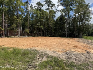 Exceptional opportunity to own a partially wooded lot featuring on Diamondhead Country Club in Mississippi - for sale on GolfHomes.com, golf home, golf lot