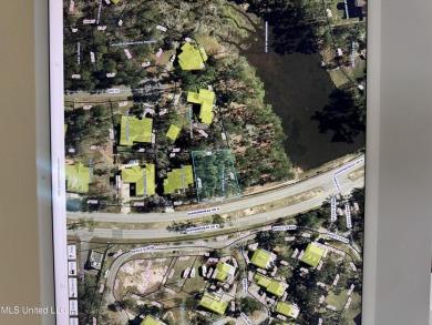 Exceptional opportunity to own a partially wooded lot featuring on Diamondhead Country Club in Mississippi - for sale on GolfHomes.com, golf home, golf lot