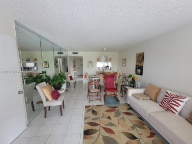 From the moment you open the door, you have an amazing lake view on Pine Island Ridge Country Club in Florida - for sale on GolfHomes.com, golf home, golf lot