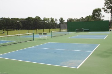 Discover the perfect blend of country, open-air, and modern on Forest Oaks Country Club in North Carolina - for sale on GolfHomes.com, golf home, golf lot