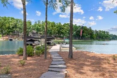 Escape to a private, peaceful lakefront sanctuary in Reynolds on Reynolds Lake Oconee - The Oconee in Georgia - for sale on GolfHomes.com, golf home, golf lot