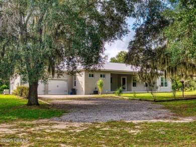 Country living meets modern convenience in this serene wooded on New Smyrna Beach Golf Course in Florida - for sale on GolfHomes.com, golf home, golf lot