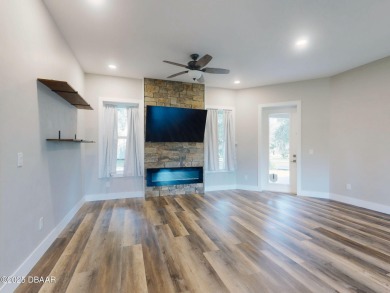 Country living meets modern convenience in this serene wooded on New Smyrna Beach Golf Course in Florida - for sale on GolfHomes.com, golf home, golf lot