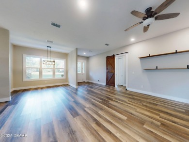Country living meets modern convenience in this serene wooded on New Smyrna Beach Golf Course in Florida - for sale on GolfHomes.com, golf home, golf lot