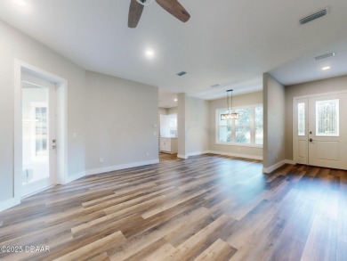 Country living meets modern convenience in this serene wooded on New Smyrna Beach Golf Course in Florida - for sale on GolfHomes.com, golf home, golf lot