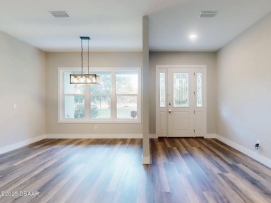 Country living meets modern convenience in this serene wooded on New Smyrna Beach Golf Course in Florida - for sale on GolfHomes.com, golf home, golf lot