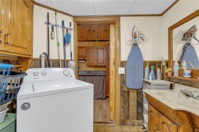 Enjoy your summer at the lake with this charming cabin located on Sugar Valley Lakes Golf Course in Kansas - for sale on GolfHomes.com, golf home, golf lot