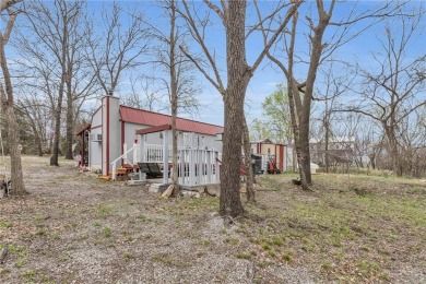 Enjoy your summer at the lake with this charming cabin located on Sugar Valley Lakes Golf Course in Kansas - for sale on GolfHomes.com, golf home, golf lot