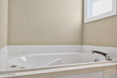 Discover easy coastal living in this beautifully updated on Members Club At St. James Plantation in North Carolina - for sale on GolfHomes.com, golf home, golf lot