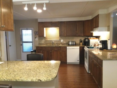 This meticulously maintained and rare three bedroom, with office on Spanish Lakes I in Florida - for sale on GolfHomes.com, golf home, golf lot