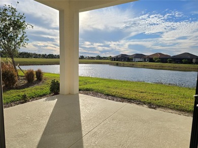 WATERFRONT HOME! Like New MAGARI MODEL HOME, including upgraded on Stonegate Golf Club in Florida - for sale on GolfHomes.com, golf home, golf lot