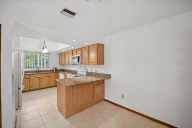 Live the golf course lifestyle! This stunning 3BR/2.5BA townhome on The Grand Club - Pine Lakes Course in Florida - for sale on GolfHomes.com, golf home, golf lot