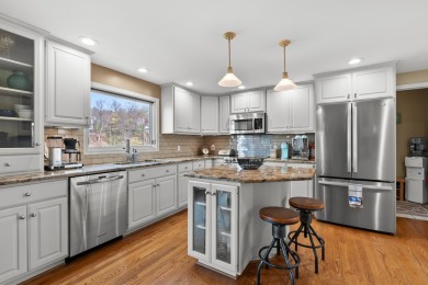 Welcome to a wonderful, classic 2-story home with a walk out on Lake Doster Golf Club in Michigan - for sale on GolfHomes.com, golf home, golf lot