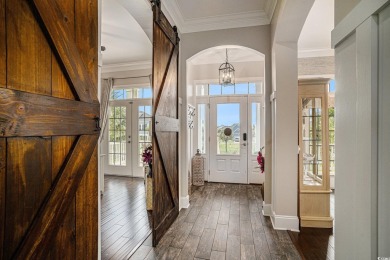 A stunning home situated directly on the Intracoastal Waterway on Myrtlewood Golf Course and Club  in South Carolina - for sale on GolfHomes.com, golf home, golf lot