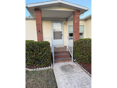 Priced to sell at $38,500, monthly lot rent is $1248 on Pine Lakes Country Club in Florida - for sale on GolfHomes.com, golf home, golf lot