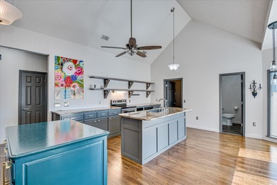 Blending designer updates with architectural appeal, this on Woodside Plantation Country Club in South Carolina - for sale on GolfHomes.com, golf home, golf lot