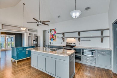 Blending designer updates with architectural appeal, this on Woodside Plantation Country Club in South Carolina - for sale on GolfHomes.com, golf home, golf lot