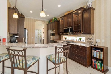 Experience luxury, privacy, and sophistication in this stunning on Lakewood Ranch Golf and Country Club in Florida - for sale on GolfHomes.com, golf home, golf lot