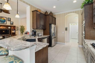 Experience luxury, privacy, and sophistication in this stunning on Lakewood Ranch Golf and Country Club in Florida - for sale on GolfHomes.com, golf home, golf lot