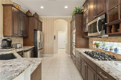 Experience luxury, privacy, and sophistication in this stunning on Lakewood Ranch Golf and Country Club in Florida - for sale on GolfHomes.com, golf home, golf lot