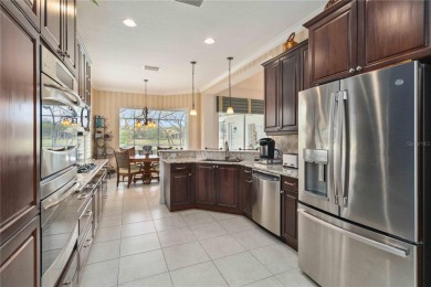 Experience luxury, privacy, and sophistication in this stunning on Lakewood Ranch Golf and Country Club in Florida - for sale on GolfHomes.com, golf home, golf lot