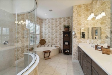 Experience luxury, privacy, and sophistication in this stunning on Lakewood Ranch Golf and Country Club in Florida - for sale on GolfHomes.com, golf home, golf lot