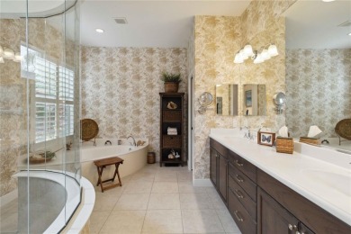 Experience luxury, privacy, and sophistication in this stunning on Lakewood Ranch Golf and Country Club in Florida - for sale on GolfHomes.com, golf home, golf lot