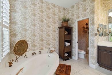 Experience luxury, privacy, and sophistication in this stunning on Lakewood Ranch Golf and Country Club in Florida - for sale on GolfHomes.com, golf home, golf lot