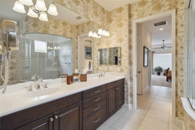Experience luxury, privacy, and sophistication in this stunning on Lakewood Ranch Golf and Country Club in Florida - for sale on GolfHomes.com, golf home, golf lot