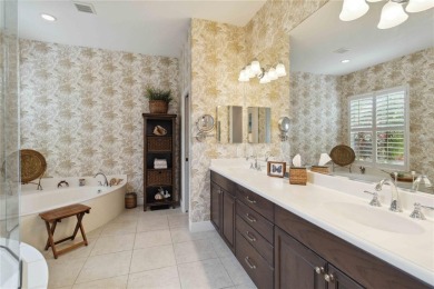 Experience luxury, privacy, and sophistication in this stunning on Lakewood Ranch Golf and Country Club in Florida - for sale on GolfHomes.com, golf home, golf lot
