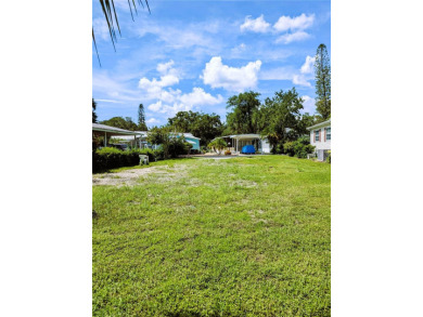 Vacant land in a mobile home community. This lot backs up to the on River Run Golf Links in Florida - for sale on GolfHomes.com, golf home, golf lot