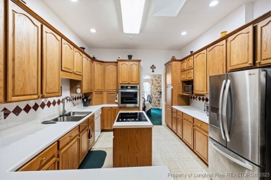 This beautifully maintained 3-bedroom, 3-bath all-brick home is on Baywood Golf Club in North Carolina - for sale on GolfHomes.com, golf home, golf lot