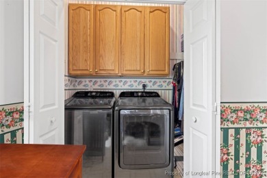 This beautifully maintained 3-bedroom, 3-bath all-brick home is on Baywood Golf Club in North Carolina - for sale on GolfHomes.com, golf home, golf lot