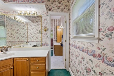 This beautifully maintained 3-bedroom, 3-bath all-brick home is on Baywood Golf Club in North Carolina - for sale on GolfHomes.com, golf home, golf lot