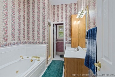 This beautifully maintained 3-bedroom, 3-bath all-brick home is on Baywood Golf Club in North Carolina - for sale on GolfHomes.com, golf home, golf lot