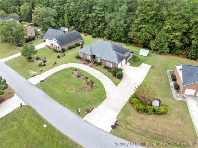 This beautifully maintained 3-bedroom, 3-bath all-brick home is on Baywood Golf Club in North Carolina - for sale on GolfHomes.com, golf home, golf lot