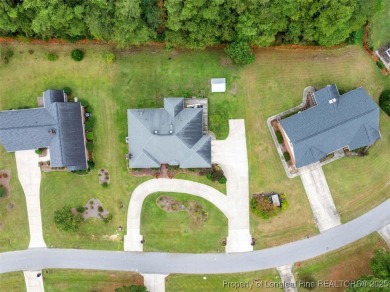 This beautifully maintained 3-bedroom, 3-bath all-brick home is on Baywood Golf Club in North Carolina - for sale on GolfHomes.com, golf home, golf lot